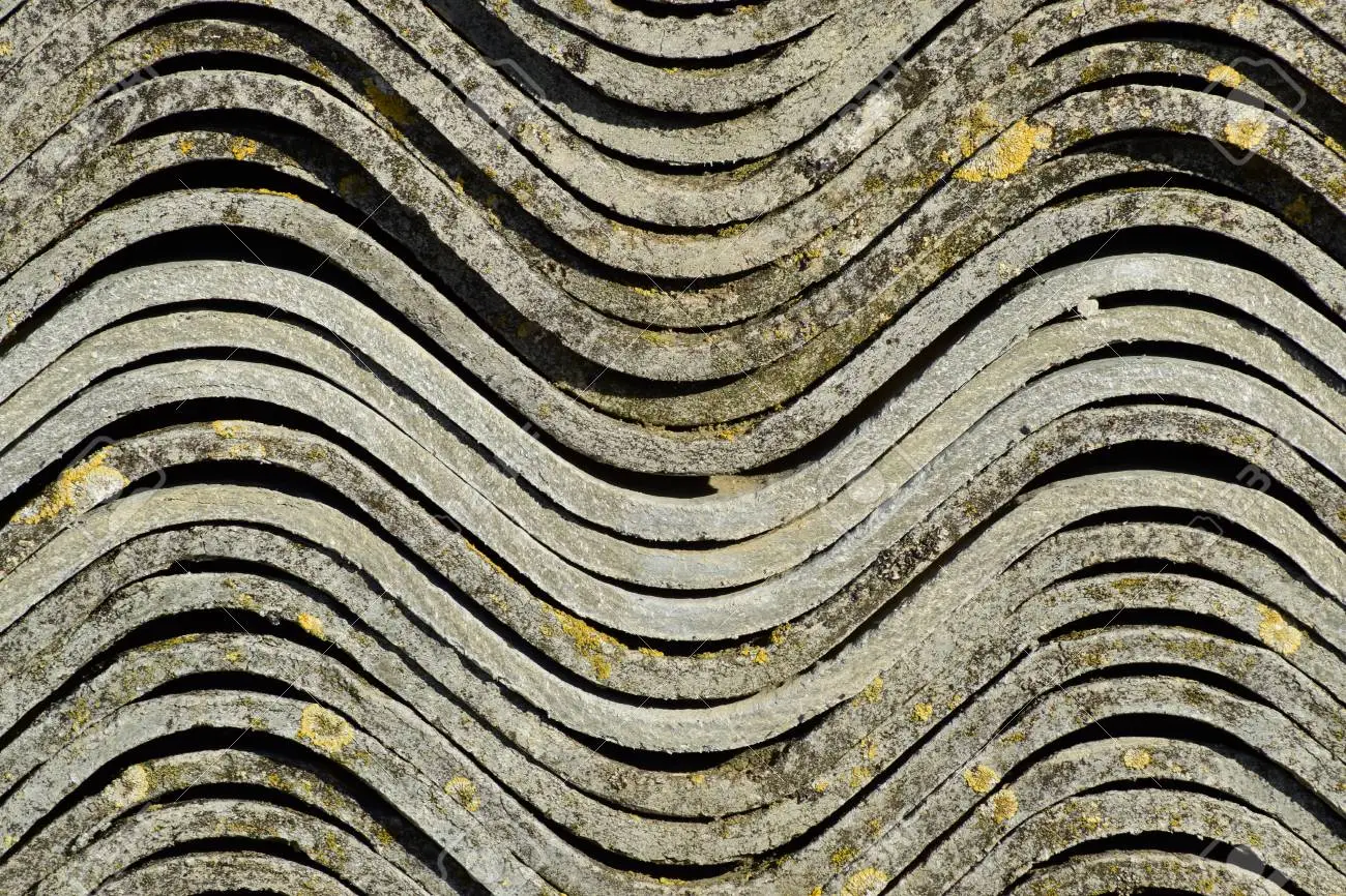 101276684-corrugated-slate-lies-in-a-pile-side-view-background-texture-of-slate